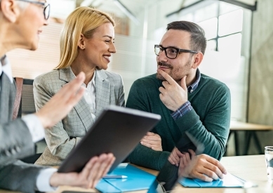 Couple talking with financial advisor